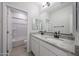 Bathroom featuring double granite vanity and a full bathtub with shower at 18207 W Daley Ln, Surprise, AZ 85387