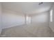 Bright and airy bonus room offers flexible living space and neutral tones at 18207 W Daley Ln, Surprise, AZ 85387
