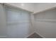 Spacious walk-in closet with ample shelving and neutral carpet at 18207 W Daley Ln, Surprise, AZ 85387