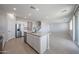 Well-lit kitchen featuring a central island, stainless steel appliances, and an open layout at 18207 W Daley Ln, Surprise, AZ 85387