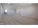 Upstairs loft area featuring neutral carpet, white railings, and plenty of space to enjoy at 18207 W Daley Ln, Surprise, AZ 85387
