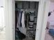 Organized closet with shelves, hanging rods, and neatly arranged clothes and storage containers at 1941 S Pierpont Dr # 1025, Mesa, AZ 85206