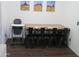 Cozy dining area featuring a wooden table with iron chairs, accented by southwestern wall art at 1941 S Pierpont Dr # 1025, Mesa, AZ 85206