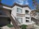 A three-story building featuring a stairway entrance and a neutral color scheme at 1941 S Pierpont Dr # 1025, Mesa, AZ 85206