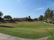 Well-manicured lawns at this garden-style apartment complex featuring mature trees and a walking path at 1941 S Pierpont Dr # 1025, Mesa, AZ 85206