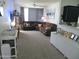 A spacious living room featuring a large sectional couch and neutral colors at 1941 S Pierpont Dr # 1025, Mesa, AZ 85206