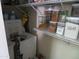 Pantry shelves with labeled containers of baking ingredients next to front load washer and dryer at 1941 S Pierpont Dr # 1025, Mesa, AZ 85206