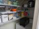 Pantry shelves filled with labeled containers of baking ingredients and cooking appliances at 1941 S Pierpont Dr # 1025, Mesa, AZ 85206