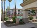 Pool and residential buildings with palm trees in the distance at 1941 S Pierpont Dr # 1025, Mesa, AZ 85206