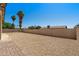 Spacious backyard featuring desert landscaping, a privacy wall, and a brick border at 3747 E Harmony Ave, Mesa, AZ 85206