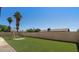Backyard featuring a playground and lush, green synthetic turf at 3747 E Harmony Ave, Mesa, AZ 85206