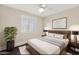 Bedroom featuring neutral color scheme, bright natural lighting, and ceiling fan at 3747 E Harmony Ave, Mesa, AZ 85206