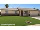 Exterior of a charming single-story home featuring a well-manicured lawn and a two-car garage at 3747 E Harmony Ave, Mesa, AZ 85206