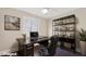 Office featuring a large desk, shelving unit, and a comfortable office chair at 3747 E Harmony Ave, Mesa, AZ 85206