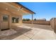 Covered patio featuring bright, natural light, exterior access door, and concrete floors at 3747 E Harmony Ave, Mesa, AZ 85206