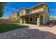 The brick patio leads to a large lawn and covered patio at 4059 E Mesquite St, Gilbert, AZ 85296