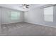 Cozy bedroom featuring neutral carpet and a ceiling fan at 4059 E Mesquite St, Gilbert, AZ 85296