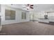 Open floorplan showcasing a living room with fireplace, natural light, leading into the kitchen at 4059 E Mesquite St, Gilbert, AZ 85296