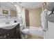 Clean bathroom with a vanity, toilet and a shower and tub combination at 7625 E Camelback Rd # A108, Scottsdale, AZ 85251