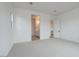 Bright bedroom featuring neutral carpet, ensuite bathroom, and contemporary design at 1246 E Penedes Dr, Gilbert, AZ 85298