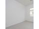 Bright bedroom featuring neutral carpet, a window, and contemporary design at 1246 E Penedes Dr, Gilbert, AZ 85298
