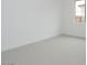 Bright bedroom featuring neutral carpet, a window, and contemporary design at 1246 E Penedes Dr, Gilbert, AZ 85298