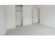 Bright bedroom featuring neutral carpet, a closet, and contemporary design at 1246 E Penedes Dr, Gilbert, AZ 85298