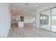 An open floorplan with wood-look tile, recessed lighting, and a combined living, kitchen, and dining area at 1246 E Penedes Dr, Gilbert, AZ 85298