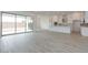 Bright open concept kitchen and living space with modern appliances, white cabinetry, and wood-look floors at 1246 E Penedes Dr, Gilbert, AZ 85298