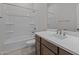 Clean bathroom featuring a vanity, a mirror, a bathtub, and a shower head at 19323 W San Juan Ave, Litchfield Park, AZ 85340