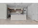Modern kitchen with stainless steel appliances, granite countertops, pendant lighting, and a spacious center island at 19323 W San Juan Ave, Litchfield Park, AZ 85340