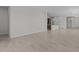 Open-concept living space with neutral tile floors provides seamless flow to the kitchen area at 19323 W San Juan Ave, Litchfield Park, AZ 85340