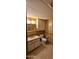 A bathroom features a vanity, toilet, mirror and a tiled floor at 25 S 102Nd St # 79, Mesa, AZ 85208