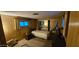 A cozy bedroom features a twin bed, mirrored closet, and wood-paneled walls at 25 S 102Nd St # 79, Mesa, AZ 85208