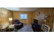 The living room is furnished with a recliner and 'Open House' sign at 25 S 102Nd St # 79, Mesa, AZ 85208