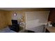 A living room featuring an 'Open House' sign, TV, and vertical blinds at 25 S 102Nd St # 79, Mesa, AZ 85208