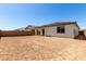 Large backyard featuring a covered patio, providing an ideal setting for outdoor gatherings and leisure at 5011 W Hardtack Trl, Laveen, AZ 85339