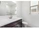 Well-lit bathroom featuring a sleek vanity, modern fixtures, and grab bar in the shower at 5011 W Hardtack Trl, Laveen, AZ 85339
