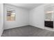 Carpeted bedroom showcasing a window, natural light, and a view of an attached bathroom at 5011 W Hardtack Trl, Laveen, AZ 85339