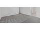 Spacious carpeted bedroom with neutral walls leading to bathroom with shower at 5011 W Hardtack Trl, Laveen, AZ 85339