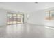 Bright living room featuring tile floors, recessed lighting, and sliding glass doors to the backyard at 5011 W Hardtack Trl, Laveen, AZ 85339