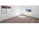 Bright bedroom with plush carpet and ample natural light for a cozy and inviting atmosphere at 626 W Pintail Dr, Casa Grande, AZ 85122