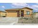 Charming single-story home featuring a two-car garage and low maintenance landscaping for effortless curb appeal at 626 W Pintail Dr, Casa Grande, AZ 85122