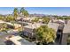 Scenic aerial view of the property showcasing the buildings, desert landscaping, and mountain views in the distance at 7009 E Acoma, Lot #2060 Dr # 2060, Scottsdale, AZ 85254