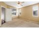 Empty bedroom with carpet, a ceiling fan, and natural light coming through the windows at 7009 E Acoma, Lot #2060 Dr # 2060, Scottsdale, AZ 85254