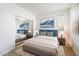 Bedroom featuring a queen bed, a closet with sliding doors, and natural light from a window at 7009 E Acoma, Lot #2060 Dr # 2060, Scottsdale, AZ 85254