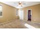 Empty bedroom featuring carpet, a ceiling fan, and natural light from a window at 7009 E Acoma, Lot #2060 Dr # 2060, Scottsdale, AZ 85254