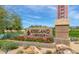 Entrance to Kierland Golf Club with stone signage, colorful flowers, and a view of the course at 7009 E Acoma, Lot #2060 Dr # 2060, Scottsdale, AZ 85254