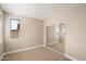 Neutral bedroom features carpet flooring, a window, and a sliding mirror closet at 7009 E Acoma, Lot 2134 Dr # 2134, Scottsdale, AZ 85254