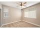 Bright bedroom features carpet flooring, a ceiling fan, and a window at 7009 E Acoma, Lot 2134 Dr # 2134, Scottsdale, AZ 85254